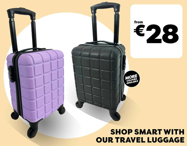 Two hard-shell rolling suitcases shown on a beige promotional background: one light purple and one black, both with telescoping handles extended. Large text reads 'from €28' and 'SHOP SMART WITH OUR TRAVEL LUGGAGE,' with a circular badge saying 'MORE COLORS AVAILABLE.
